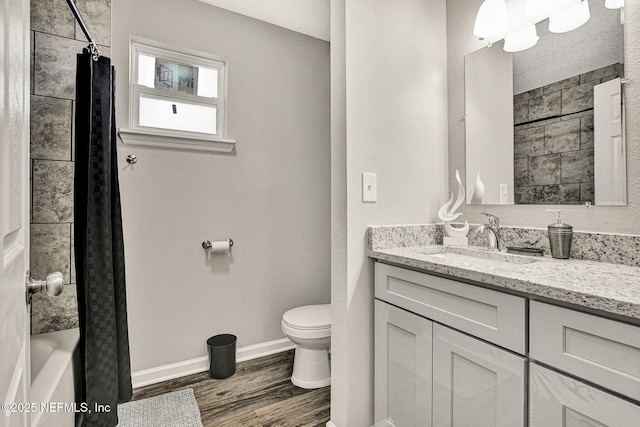 full bathroom featuring hardwood / wood-style flooring, vanity, toilet, and shower / bath combination with curtain