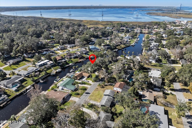 bird's eye view featuring a water view and a residential view