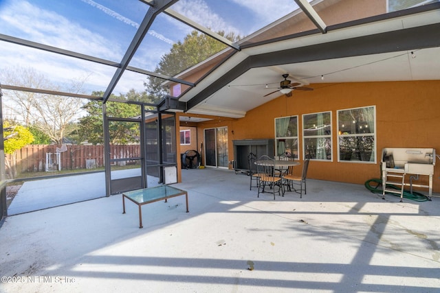 view of patio / terrace featuring a lanai and ceiling fan