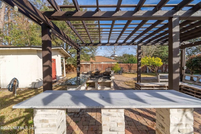 view of patio / terrace with an outdoor bar and a pergola