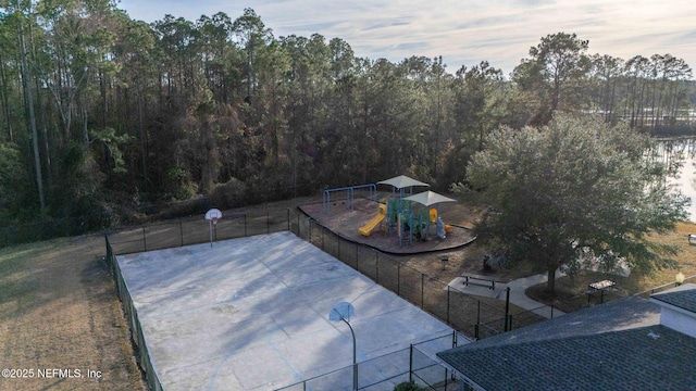 view of swimming pool with a playground