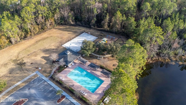 birds eye view of property with a water view