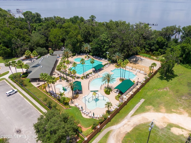 birds eye view of property with a water view