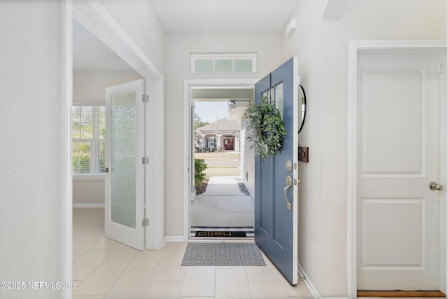 entryway featuring light tile patterned flooring