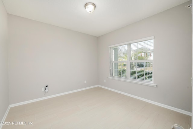 empty room with baseboards