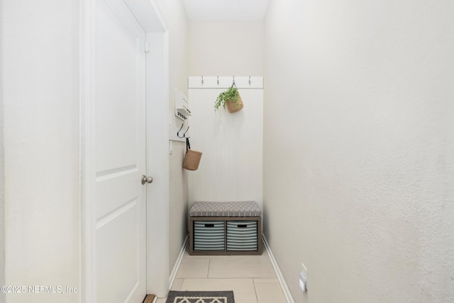 mudroom featuring baseboards and tile patterned floors