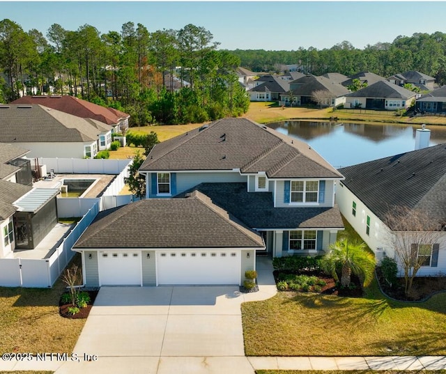 aerial view with a residential view and a water view