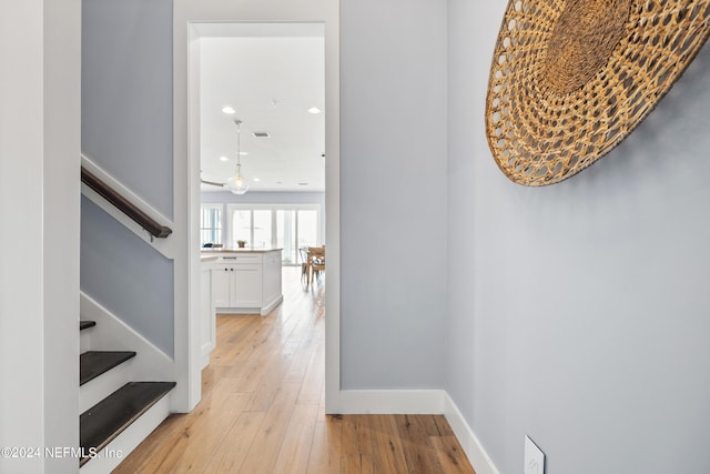 corridor featuring light hardwood / wood-style floors