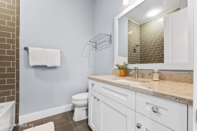 full bathroom featuring shower / bathtub combination, vanity, toilet, and tile patterned flooring