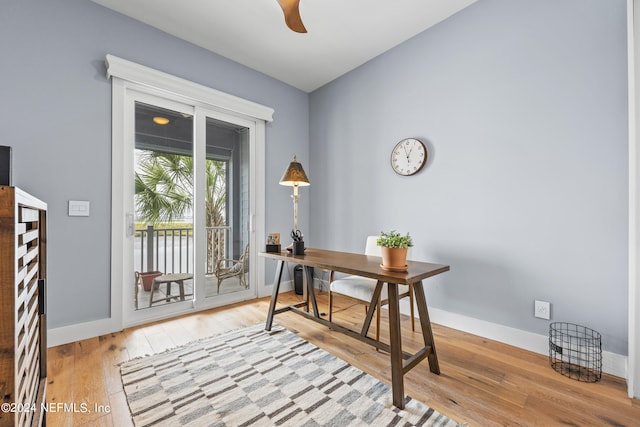 office area with light hardwood / wood-style flooring and ceiling fan