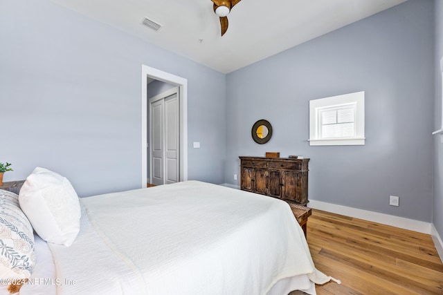 bedroom with hardwood / wood-style flooring and ceiling fan