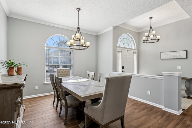 dining room with crown molding, dark hardwood / wood-style floors, and a chandelier