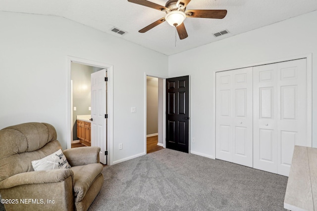 living area with ceiling fan, lofted ceiling, and carpet