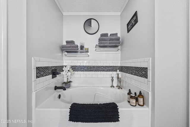 bathroom with a textured ceiling and a washtub