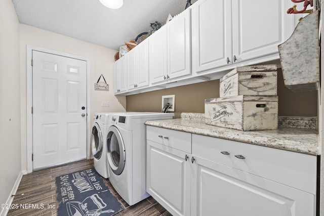 laundry area featuring independent washer and dryer and cabinets