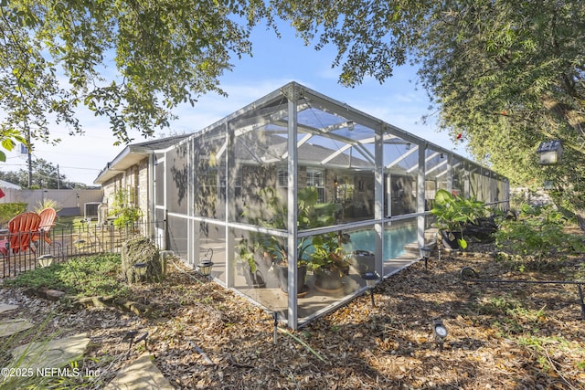 view of home's exterior featuring a lanai