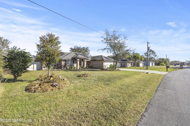 ranch-style home featuring a front yard