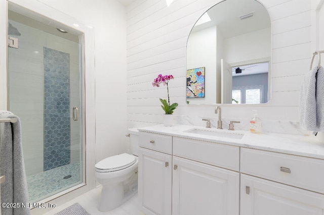 full bathroom with a stall shower, visible vents, vanity, and toilet