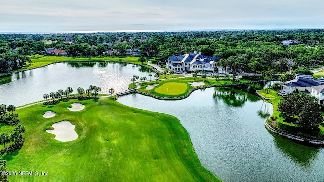 birds eye view of property featuring a water view and view of golf course