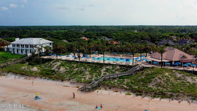 birds eye view of property with a wooded view