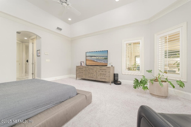 carpeted bedroom featuring arched walkways, recessed lighting, visible vents, and baseboards