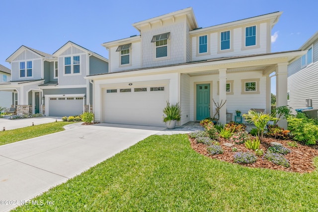 view of front of house featuring a garage and a front yard