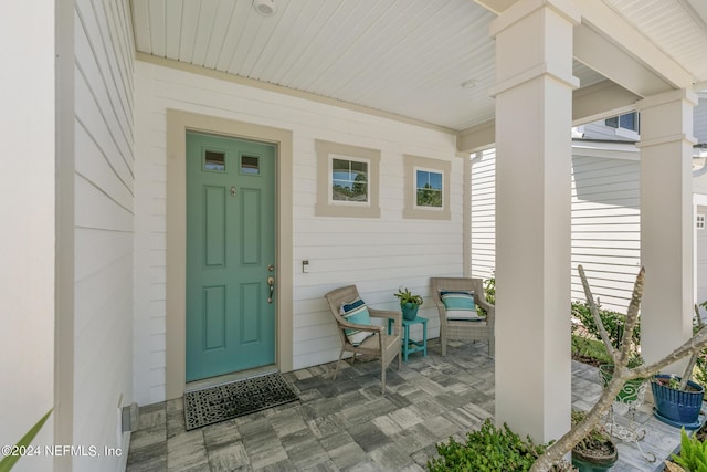 entrance to property featuring covered porch