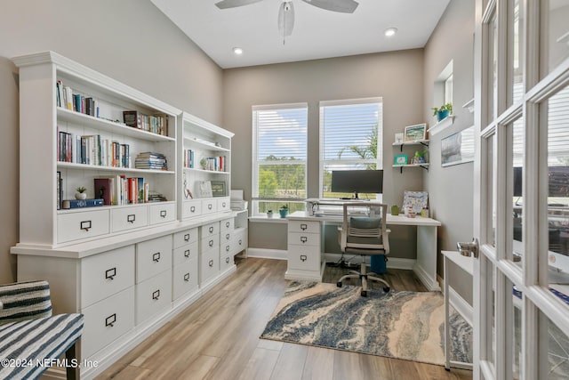 home office featuring ceiling fan and light hardwood / wood-style floors