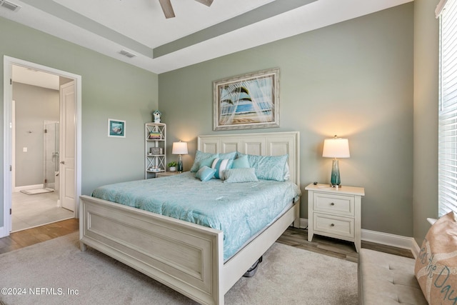 bedroom with ceiling fan and light wood-type flooring