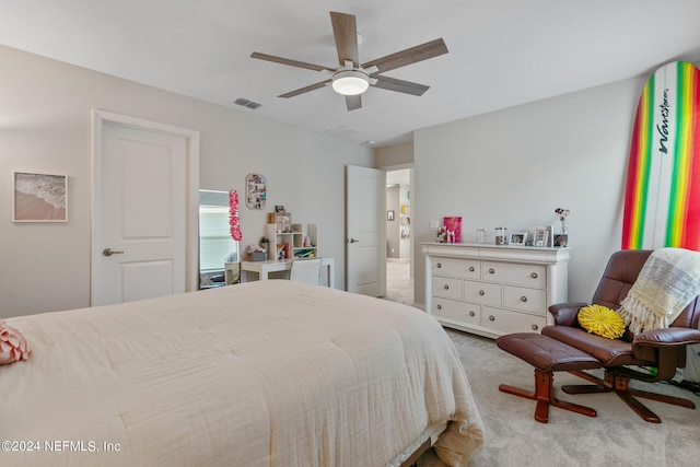 bedroom featuring light carpet and ceiling fan