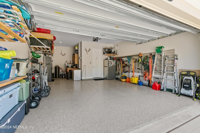 garage with stainless steel fridge