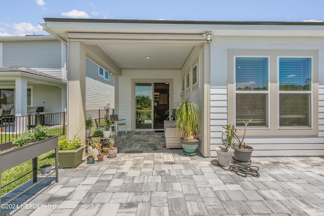 doorway to property with a patio