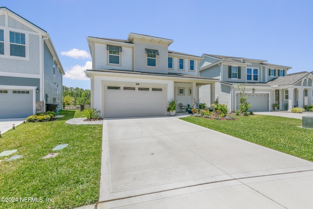 view of front of house with a garage and a front yard