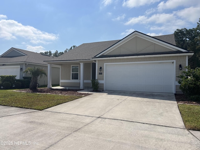 single story home with a garage and a front yard