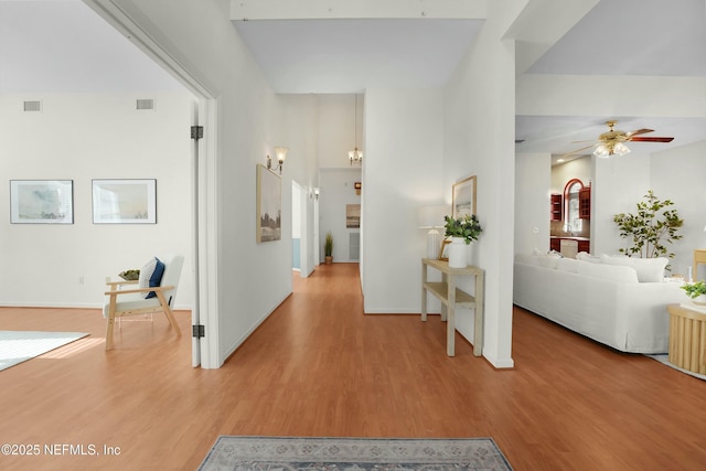 hall with light hardwood / wood-style flooring