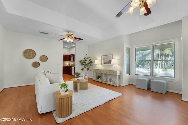 unfurnished living room with hardwood / wood-style flooring and ceiling fan