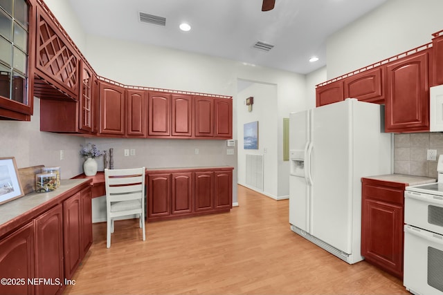 kitchen featuring tasteful backsplash, white appliances, light hardwood / wood-style floors, and ceiling fan