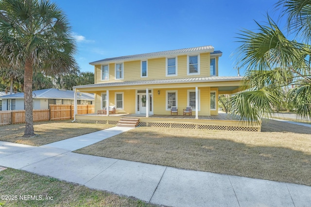 view of front of property with a porch and a front lawn