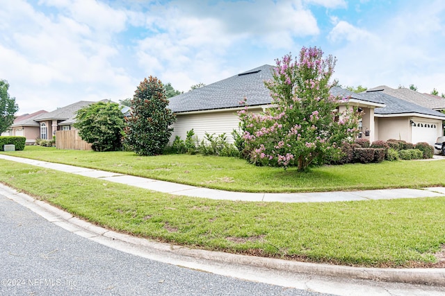 view of property exterior with a yard