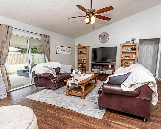 living room featuring ceiling fan, lofted ceiling, dark hardwood / wood-style floors, and a textured ceiling