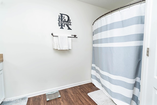 bathroom with wood-type flooring