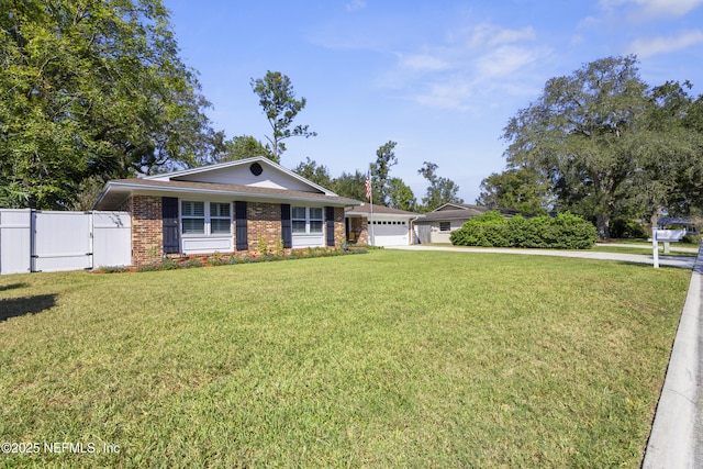 ranch-style house featuring a garage and a front yard