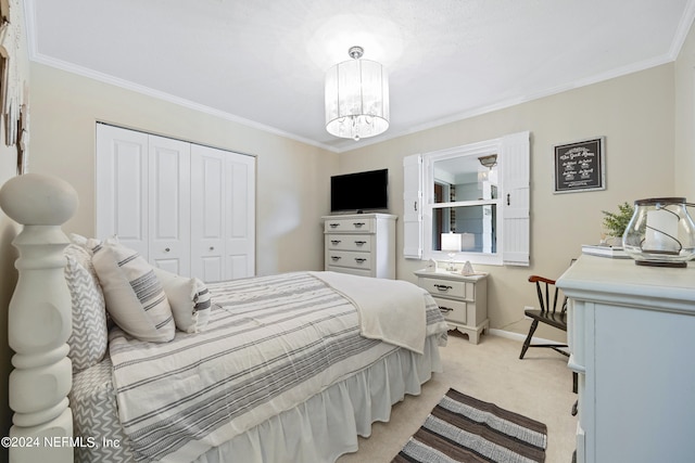 bedroom featuring a notable chandelier, ornamental molding, light colored carpet, and a closet