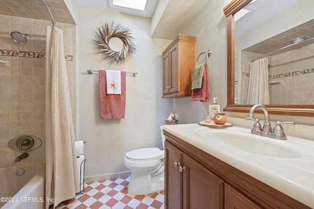 full bathroom featuring vanity, toilet, a skylight, and shower / bath combo with shower curtain