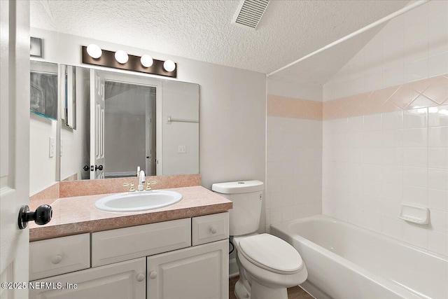 full bathroom featuring vanity, vaulted ceiling, toilet, and a textured ceiling