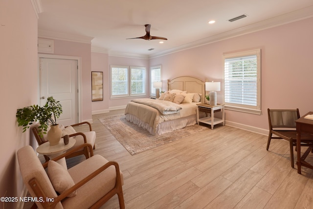 bedroom with multiple windows, crown molding, and light hardwood / wood-style floors