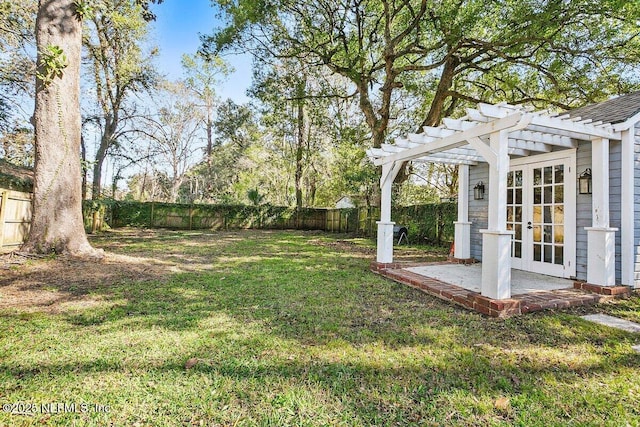 view of yard featuring french doors and a pergola