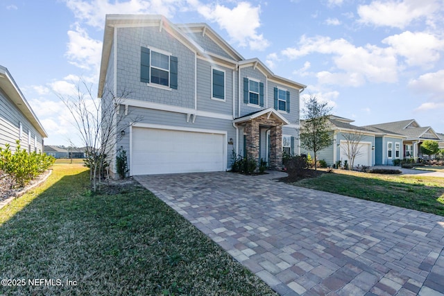 view of front of home featuring a garage and a front lawn