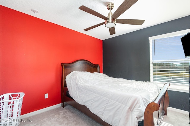 bedroom with ceiling fan and carpet flooring