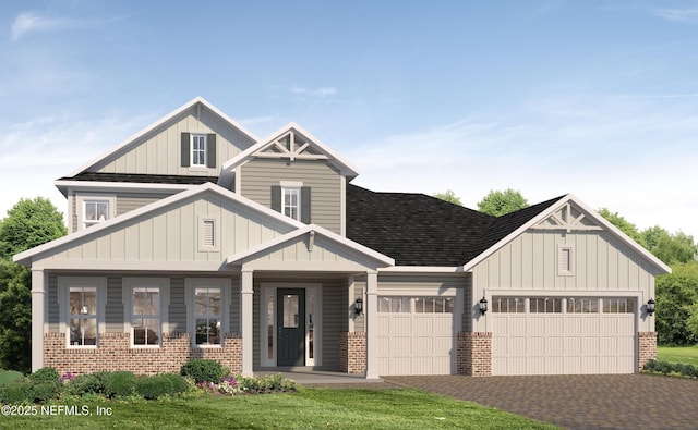 view of front of property featuring a garage, decorative driveway, board and batten siding, and brick siding